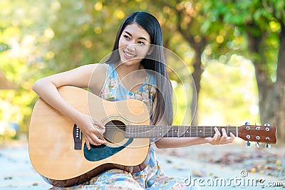 Woman playing guitar Stock Photo