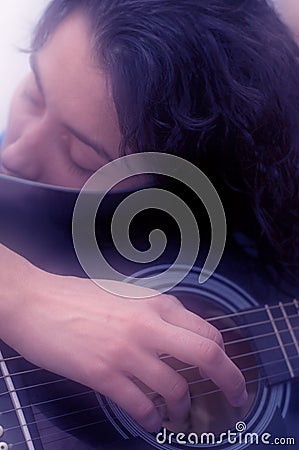 Woman Playing Guitar Soft Focus Stock Photo