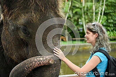 Woman with the elephant Editorial Stock Photo