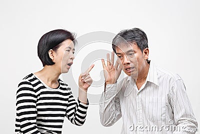 Woman pointing her finger against and blame her husband Stock Photo