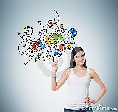 A woman is pointing out the finger on the colourful sketch of a plan for business development activities. Light blue back Stock Photo