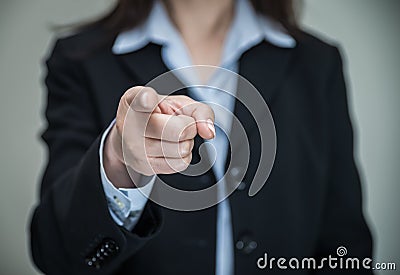 Woman pointing at you with one finger Stock Photo