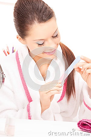 Woman polishing her nails Stock Photo