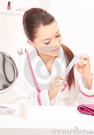 Woman polishing her nails Stock Photo