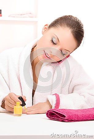 Woman polishing her nails Stock Photo