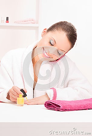 Woman polishing her nails Stock Photo