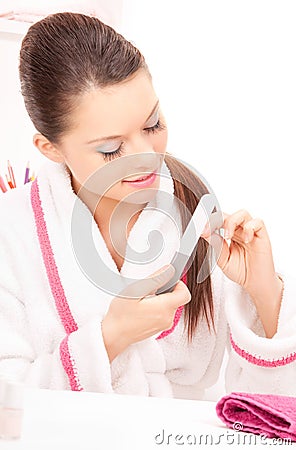 Woman polishing her nails Stock Photo