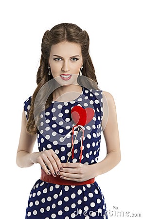 Woman in Polka Dot Dress with Heart, Retro Girl Pin Up Hair Style, Beauty Make Up and Hairstyle, Isolated Over White Background Stock Photo