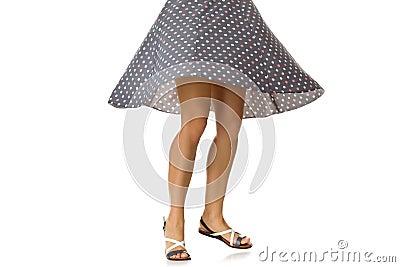 Woman in polka-dot dress standing in shoes Stock Photo