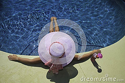 Woman poolside Stock Photo