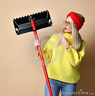 Woman with portable shovel spade concept studio shot Stock Photo