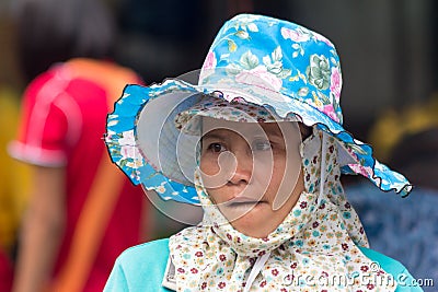 Woman porter, Khlong Toei wet market, Bangkok, Thailand Editorial Stock Photo