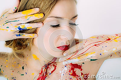 Woman portrait with closed eyes in paint with red lips Stock Photo