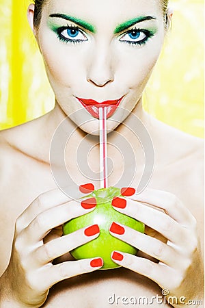 Woman portrait drinking apple juice Stock Photo