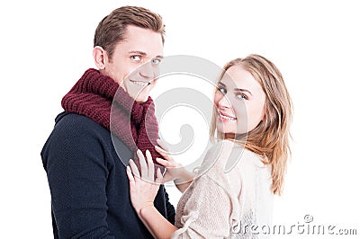 Woman posing and arranging man's autumn casual neckcloth Stock Photo