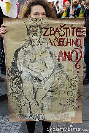 Woman with poster against Babis attending the demonstration on Prague Wenceslas square against the current government Editorial Stock Photo