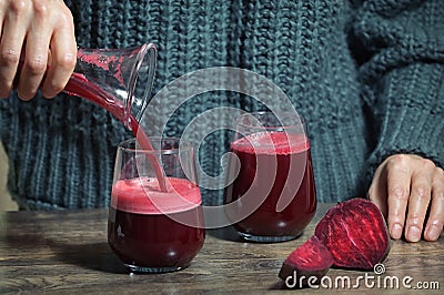 Woman Pouring Self Made Beet Juice Stock Photo