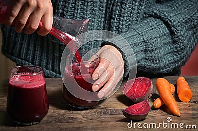 Woman Pouring Self Made Beet Juice Stock Photo