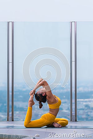 Woman pratice yoga workout training pose show body flexibilty and balance Stock Photo