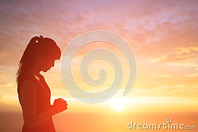 Woman pray pious Stock Photo