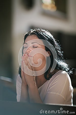 Woman praying Stock Photo