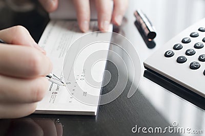 Woman prepare writing a check Stock Photo