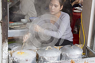 Woman is preparing banh cuon Editorial Stock Photo