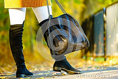 Woman presenting high knee black boots Stock Photo