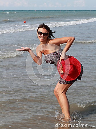 Woman presenting new product at sea Stock Photo