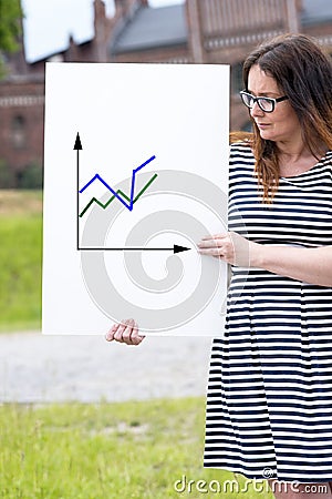 Woman presenting statistical reports Stock Photo