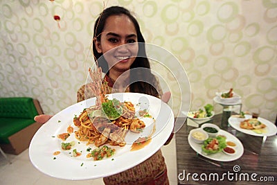 A woman presents a special menu at the Chinese New Year Editorial Stock Photo