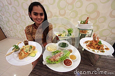 A woman presents a special menu at the Chinese New Year Editorial Stock Photo