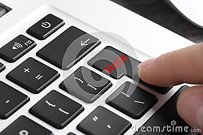 Woman pressing button with text Hate on computer keyboard, closeup Stock Photo