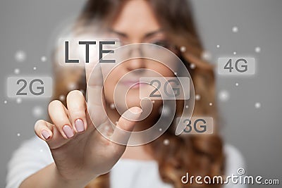 Woman pressing LTE touchscreen button Stock Photo