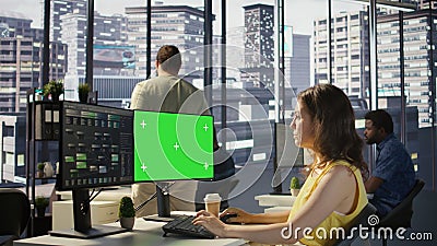 Woman programming using chroma key computer Stock Photo