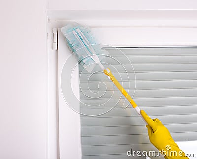 Woman dusting home Stock Photo