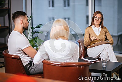 Professional psychologist consulting married couple Stock Photo