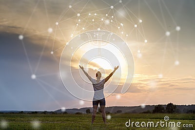 Woman pulls her hands to the sun on the background of a symbol of psychology Stock Photo