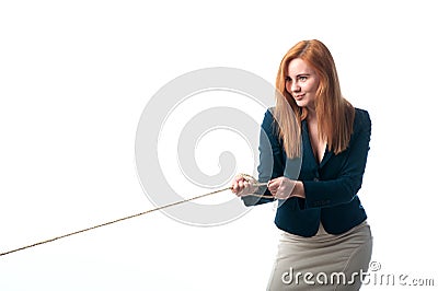 Woman pulls the rope Stock Photo