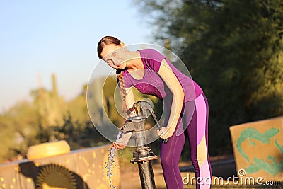 Woman Pumping a Well Stock Photo