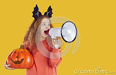 Woman with pumpkin and megaphone making announcement about Halloween event or holiday sale Stock Photo