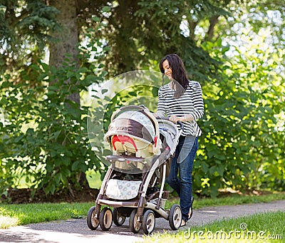 https://thumbs.dreamstime.com/x/woman-pushing-baby-carriage-park-happy-young-36518071.jpg