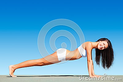 Woman, pushup and fitness with healthy body, sky or happiness in mockup space, workout or sunshine. Girl, smile and Stock Photo