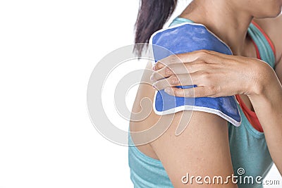 Woman putting an ice pack on her shoulder Stock Photo