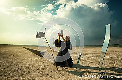 Woman putting a mask on her face Stock Photo