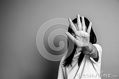 Woman raised her hand for dissuade, campaign stop violence against women Stock Photo