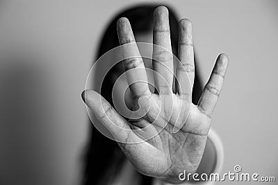 Woman raised her hand for dissuade, campaign stop violence against women. Asian woman raised her hand for dissuade with copy space Stock Photo