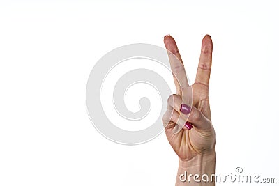 Woman raising two fingers up on hand it is shows peace strength fight or victory symbol and letter V in sign language on white Stock Photo