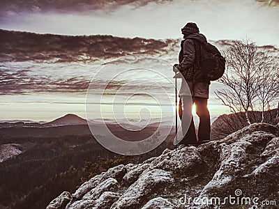 Woman reached mount peak. Girl wears backpack and sunglasses Stock Photo