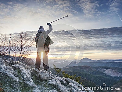 Woman reached mount peak. Girl wears backpack and sunglasses Stock Photo